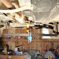 Universal under vehicle engine and gearbox support