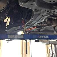 Universal under vehicle engine and gearbox support
